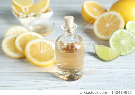Citrus essential oil on white wooden table Citrus essential oil on white wooden table 142414935