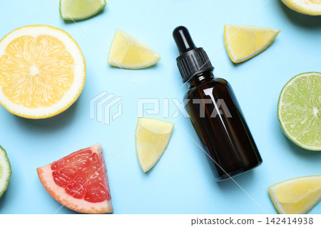 Flat lay composition with citrus essential oil on light blue background Flat lay composition with citrus essential oil on light blue background 142414938