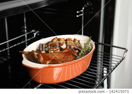 Delicious roasted ribs with thyme in oven 142415073
