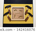 A unique overseas puzzle where a wooden hammer fits neatly into the frame. 142416076