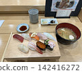 Enjoy a Japanese lunch featuring fresh nigiri sushi and miso soup. 142416272