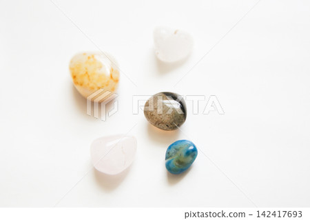 Colorful stones on a white background Colorful stones on a white background 142417693