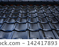 Image of black roof tiles 142417893