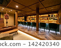 A stylish bar with a traditional Japanese hearth 142420340