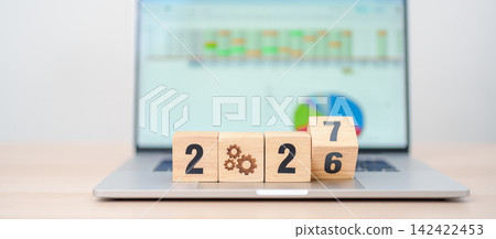 2026 end year to Happy New Year 2027 block with gear icon against laptop computer. Business Process, Team, teamwork, Goal, Target, Resolution, strategy, plan, Action, motivation, change and brainstorm 2026 end year to Happy New Year 2027 block with gear icon against laptop computer. Business Process, Team, teamwork, Goal, Target, Resolution, strategy, plan, Action, motivation, change and brainstorm 142422453
