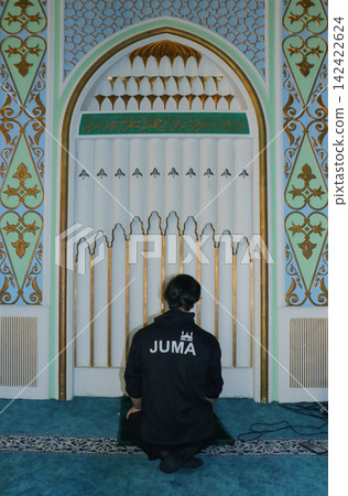 Muslim man and praying in mosque 142422624
