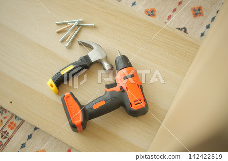 Tools on a wooden surface for a DIY project Tools on a wooden surface for a DIY project 142422819