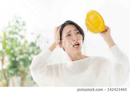 A woman with a wallet A woman with a wallet 142423465
