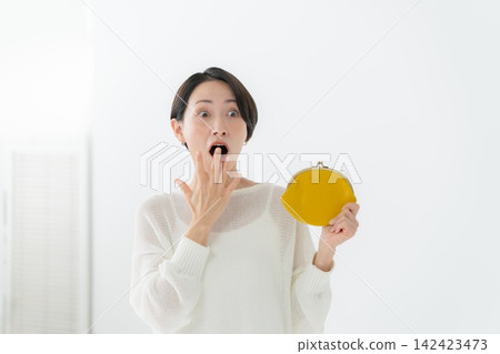 A woman with a wallet A woman with a wallet 142423473