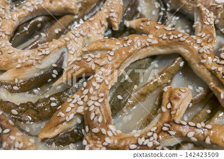 Top view close-up of baked pear puff pastry tart with sesame lattice pattern Top view close-up of baked pear puff pastry tart with sesame lattice pattern 142423509