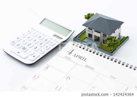 April calendar and white calculator April calendar and white calculator 142424364