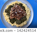 Veal liver with shallots on a bed of Taglionelli and spinach 142424514