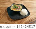 Thai street food on black dish with Gaeng Keow Wan , Thai green curry on wooden background 142424517