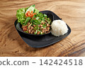 Thai street food on black dish with Spicy minced pork 142424518