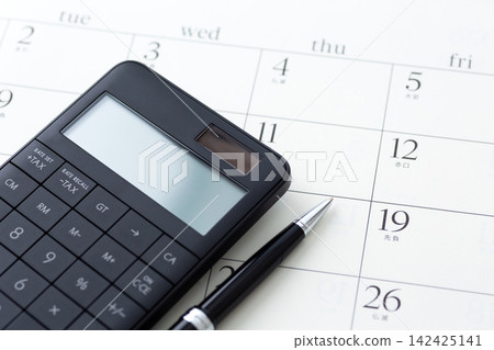 Calendar and black calculator Calendar and black calculator 142425141