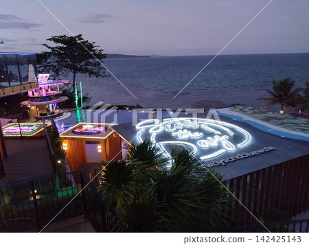 View of the pool and sea from a hotel on Boracay Island, night view. View of the pool and sea from a hotel on Boracay Island, night view. 142425143