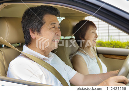 A senior couple going out in their car A senior couple going out in their car 142425266