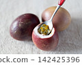 Passion fruit scooped with spoon 142425396