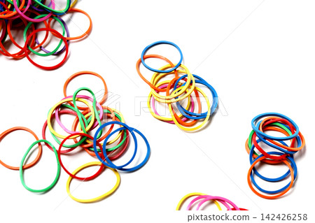 Piles of colorful elastic rubber bands Piles of colorful elastic rubber bands 142426258