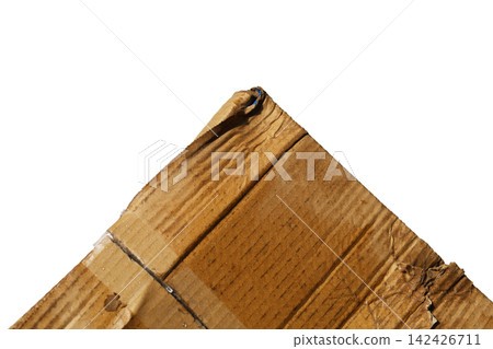 A heavily damaged, wet, and torn brown corrugated cardboard box. A heavily damaged, wet, and torn brown corrugated cardboard box. 142426711