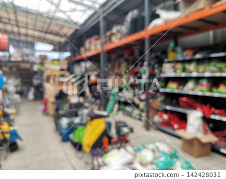 Defocused interior of a sporting goods store Defocused interior of a sporting goods store 142428031