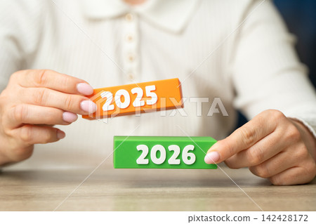Comparison of 2025 and 2026. Year in review concept with results analysis and progress evaluation. Looking ahead supports planning and future goals. Comparison of 2025 and 2026. Year in review concept with results analysis and progress evaluation. Looking ahead supports planning and future goals. 142428172