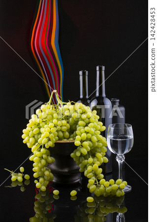 Still life with grapes and wine in glasses Still life with grapes and wine in glasses 142428453