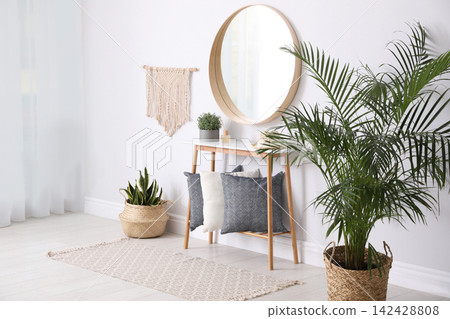 Round mirror and plants at home. Idea for interior design Round mirror and plants at home. Idea for interior design 142428808