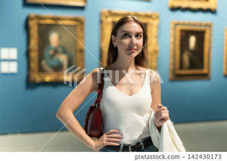Girl view pictures and icons in museum hall Girl view pictures and icons in museum hall 142430173