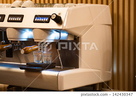 Espresso machine preparing fresh coffee in cafe kitchen Espresso machine preparing fresh coffee in cafe kitchen 142430347