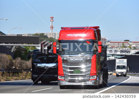 Track running on highway Track running on highway 142430359