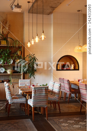 Relaxing corner featuring comfortable seating and sunlight Relaxing corner featuring comfortable seating and sunlight 142431093