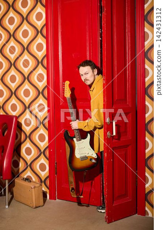 Cheerful artist captured amid nostalgic decor and positive vibes Cheerful artist captured amid nostalgic decor and positive vibes 142431312