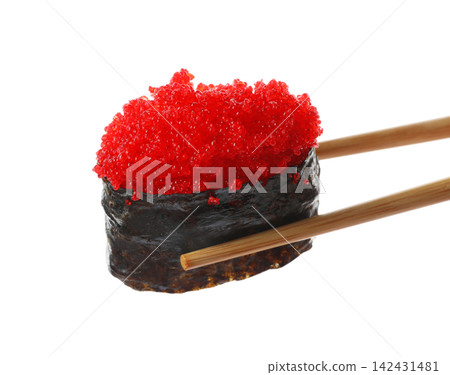 Chopsticks with tobiko sushi isolated on white Chopsticks with tobiko sushi isolated on white 142431481