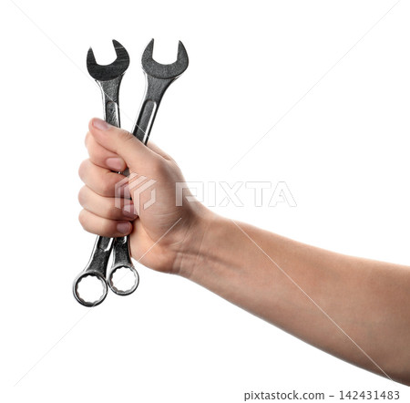 Auto mechanic holding wrenches isolated on white, closeup Auto mechanic holding wrenches isolated on white, closeup 142431483