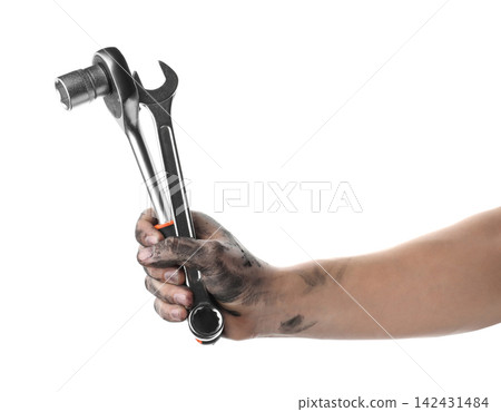 Auto mechanic holding different wrenches isolated on white, closeup Auto mechanic holding different wrenches isolated on white, closeup 142431484