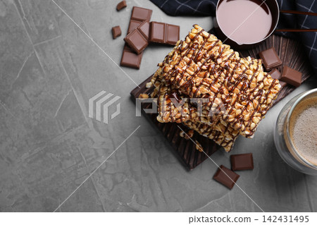 Delicious rice crispy treats on grey table, flat lay. Space for text 142431495