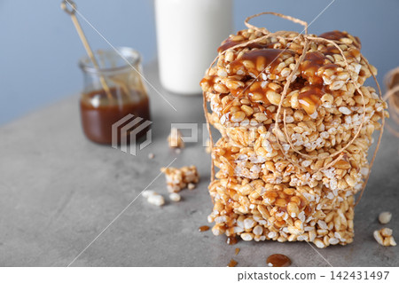 Delicious rice crispy treats on grey table. Space for text Delicious rice crispy treats on grey table. Space for text 142431497