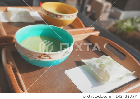 Matcha and Japanese sweets tea time in a sunny spot Matcha and Japanese sweets tea time in a sunny spot 142432357