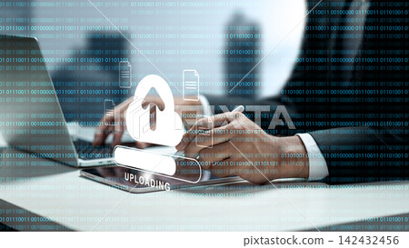 Businessman using a tablet to upload data to cloud storage, featuring a digital cloud icon and binary code background. Concept of cloud computing storage and digital storage technology Businessman using a tablet to upload data to cloud storage, featuring a digital cloud icon and binary code background. Concept of cloud computing storage and digital storage technology 142432456