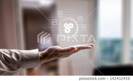 Business person holding a digital hologram of gears and document icons. Concept of cloud computing storage and digital storage technology Business person holding a digital hologram of gears and document icons. Concept of cloud computing storage and digital storage technology 142432458