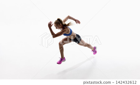 Forward leaning female runner captured during early acceleration phase. Forward leaning female runner captured during early acceleration phase. 142432612