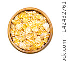 Sugar coated corn flakes, crispy breakfast cereal in a wooden bowl, isolated from above. Cornflakes, made from toasting flakes of corn, glazed with sugar. Enjoyed with milk, or eaten as snack. Photo Sugar coated corn flakes, crispy breakfast cereal in a wooden bowl, isolated from above. Cornflakes, made from toasting flakes of corn, glazed with sugar. Enjoyed with milk, or eaten as snack. Photo 142432761