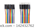 Multicolor jumper wires, rainbow ribbon cables for breadboards, isolated close up from above. 20-way jumper cables with standard Female configuration type on the left and Male on the right side. Photo Multicolor jumper wires, rainbow ribbon cables for breadboards, isolated close up from above. 20-way jumper cables with standard Female configuration type on the left and Male on the right side. Photo 142432762
