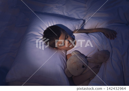 Little boy sleeping with teddy bear at home. Bedtime Little boy sleeping with teddy bear at home. Bedtime 142432964