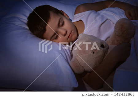 Little boy sleeping with teddy bear at home. Bedtime 142432965