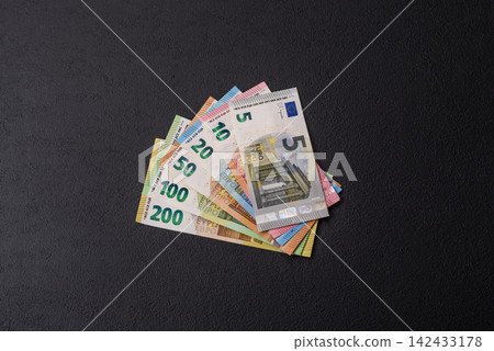 Euro, European currency cash banknotes for business and financial exchanges. Euro banknotes Euro, European currency cash banknotes for business and financial exchanges. Euro banknotes 142433178