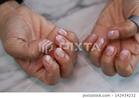Pink Glitter Nail Art on Hands Close-Up Pink Glitter Nail Art on Hands Close-Up 142434232