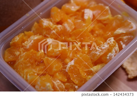 Fresh Peeled Orange Segments in Plastic Container Fresh Peeled Orange Segments in Plastic Container 142434373