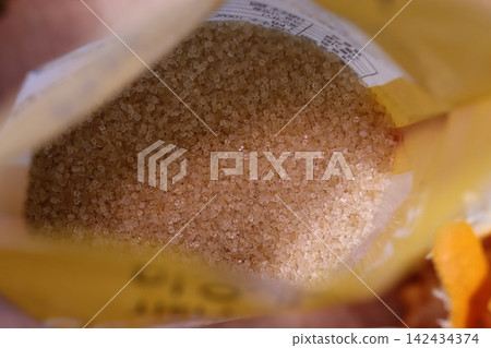 Close-up of Brown Sugar Granules in Packaging Close-up of Brown Sugar Granules in Packaging 142434374